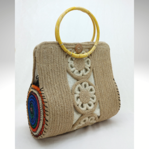 Artisan jute handbag with round bamboo handle and hand-painted floral rope detailing in a natural eco-friendly style.