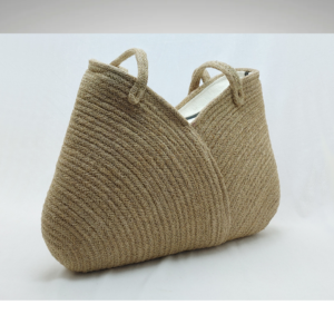 Handcrafted natural jute handbag in a neutral beige tone, featuring a soft-structured woven body with integrated handles and a minimalist, eco-friendly aesthetic.