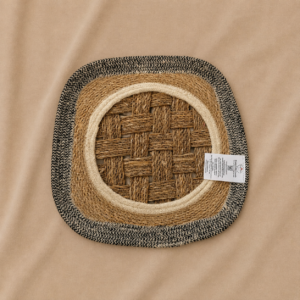 Handcrafted rounded square decorative tray made from natural jute and cane fibers, featuring a woven center, cream circular border, earthy brown layer, and black outer woven accent.